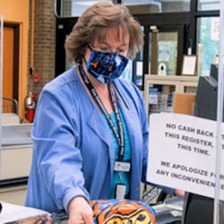 Image of a cashier wearing a mask