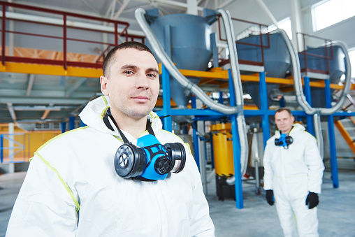 Image of employees using PPE in a manfacturing work setting