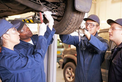 Image of workers participatinig in on the job training  for vehicle maintenance