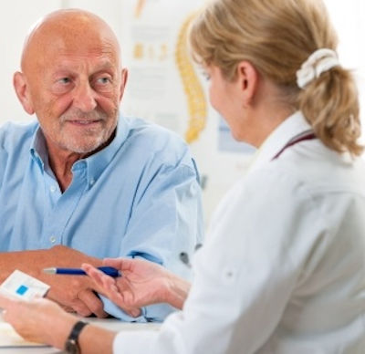 Image showing a doctor prescribing meds to a older patient