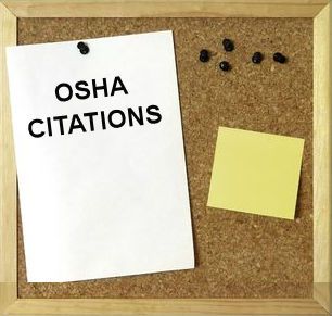 Image showing OSHA citations posted on a workplace bulletin board