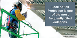 Image showing an employee outside on a platform using fall protection