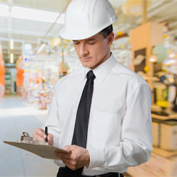 Image showing an OSHA inspector making notes