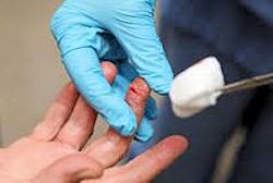 Patient with a lacerated finger and a healthcare worker providing first aid.