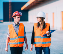 Pair of workers preparing the work plan