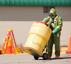 Individual worker moving a barrel