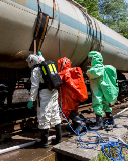 Three employees receiving HAZMAT technician level training