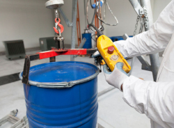 Worker checking hazardous elements of barrel