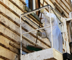 Asbestos abatement on outside of house