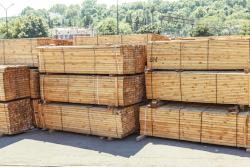 stacks of bundled treated lumber