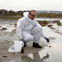 Team member collecting site samples