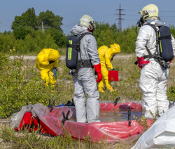 workers in the forefront wearing level B protection level A in the background