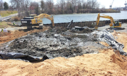 A Hazardous site during clean up with two cranes working near water