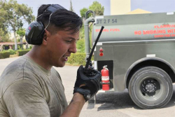 worker talking into a two-way radio