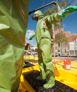 As with this worker decontamination begins with the outer boots and gloves