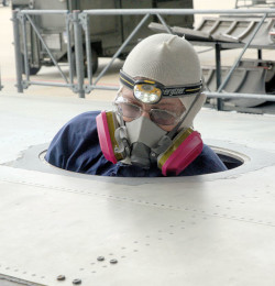 Employee entering a below ground narrow hatch confined space 