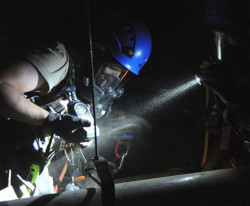 worker in dark confined space