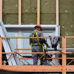 worker on elevated surface wearing fall protection