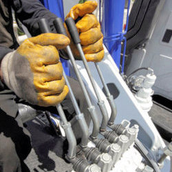 close up view of a crane operators hand positions