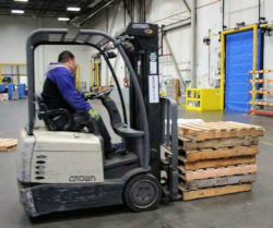 worker operating a forklift