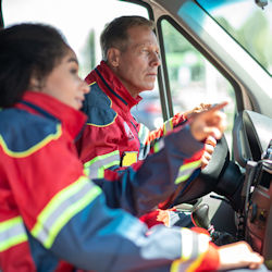 emergency responders riding in ambulance