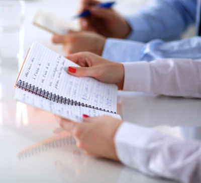 Two safety committee members making notes