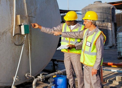 Two safety committee members helping with a inspection