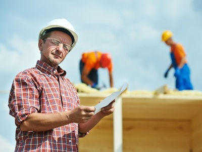 Supervisor outside in front of worksite gathering accident facts