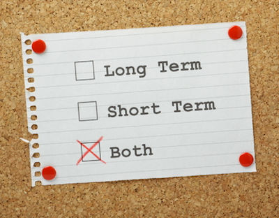 Three words written on a paper each with a check box. The words are Long Term Short Term and the last word is checked the word is both