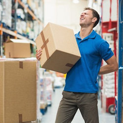 Worker holding box with sore back