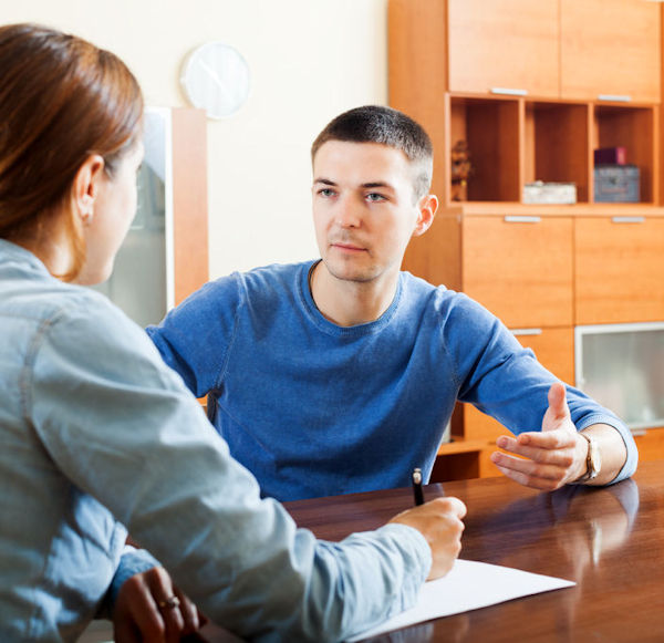 An employee interviewing a second employee