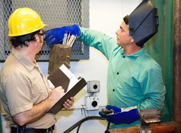 workers inspecting for hazards