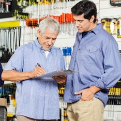 Two workers checking the JHA Job Hazard analysis steps