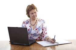 Recorder typing up the meeting minutes for distribution