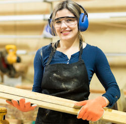 Worker carrying wood slats