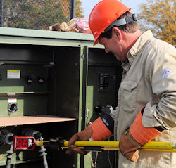 Worker performing high voltage work in properly rated PPE