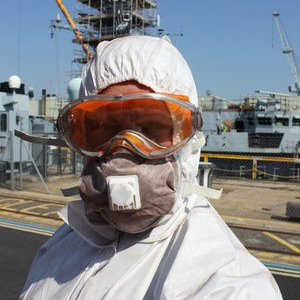 Worker wearing a filtering facepiece