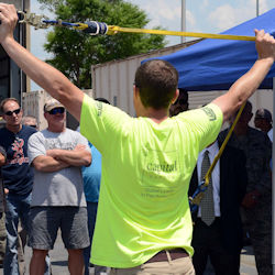 Instructor demonstrating safety procedures to a group of employees.