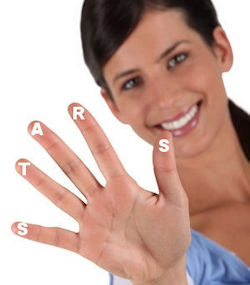 Person with stickers on fingertips spelling STARS.