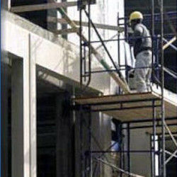 worker on fabricated scaffold