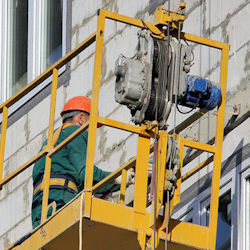 Worker on suspended scaffold