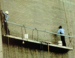 two workers on suspended scaffold