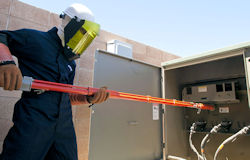 Image of worker working on live circuit - military photo