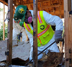 emergency responder shoveling through disaster debris