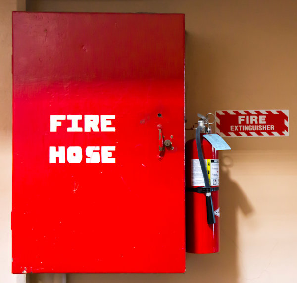 Fire hose storage and extinguisher