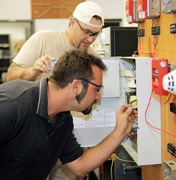 Employee being trained about actions to take during an emergency.