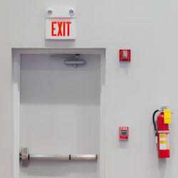 Alarm systems surrounding exit door.