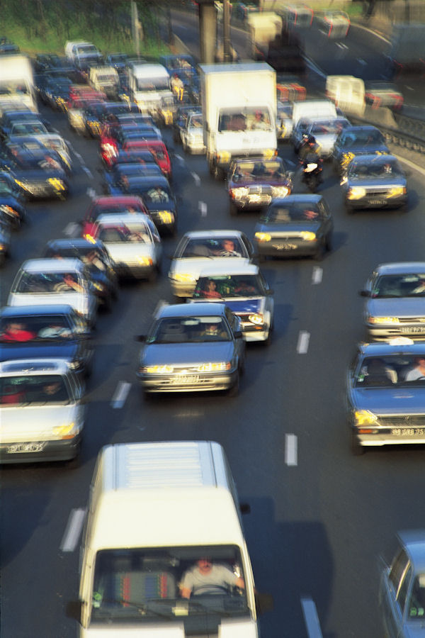 Multi lane freeway packed with cars.