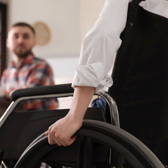 A injured employee in a wheelchair being debriefed after incident of violence