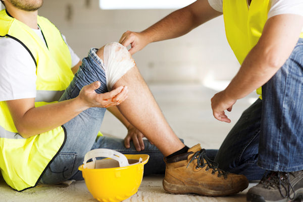 worker performaning first-aid